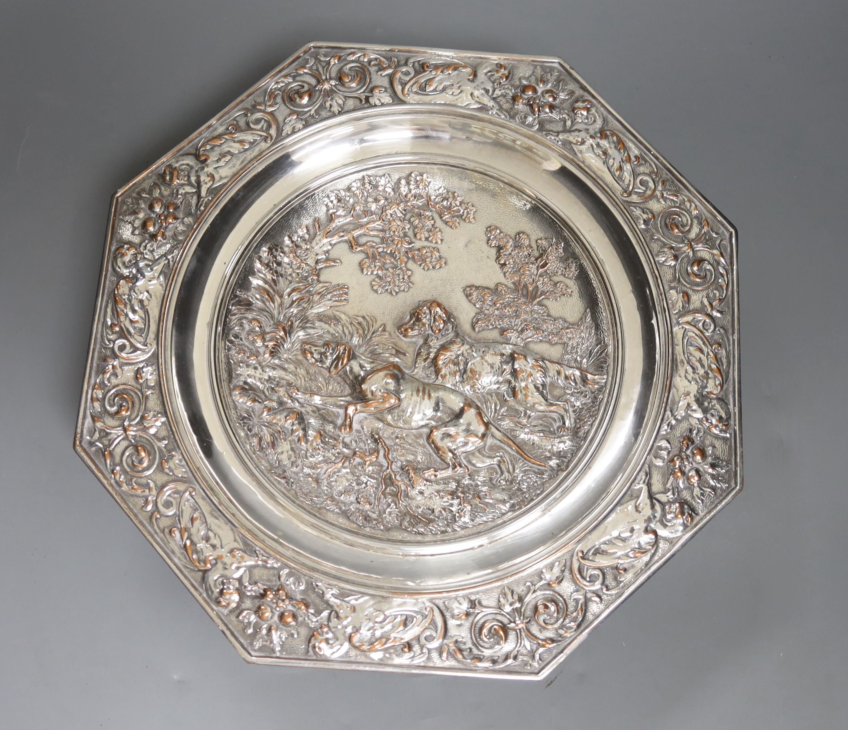 An early 20th century Elkington type silver plated tazza embossed with hunting dogs, 29cm